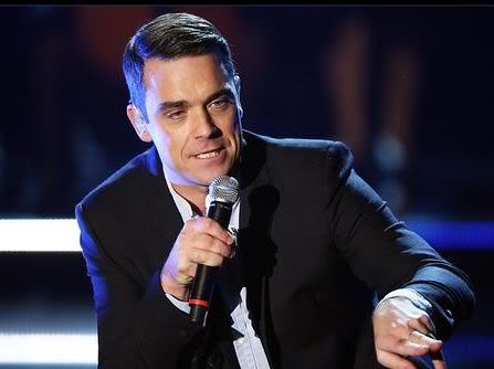 Picture of Robbie Williams conservative hairstyle.
