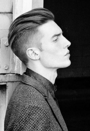 Picture of combed back undercut haircut.