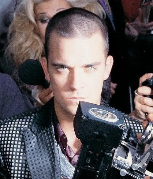 Photo of Robbie Williams buzz cut.