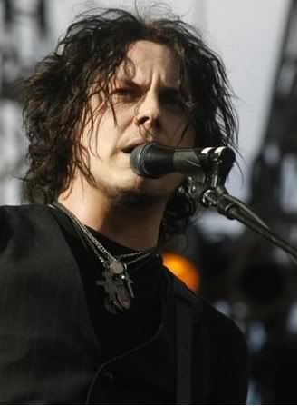 Jack White's hairstyle is achieved through a medium length layered cut.
